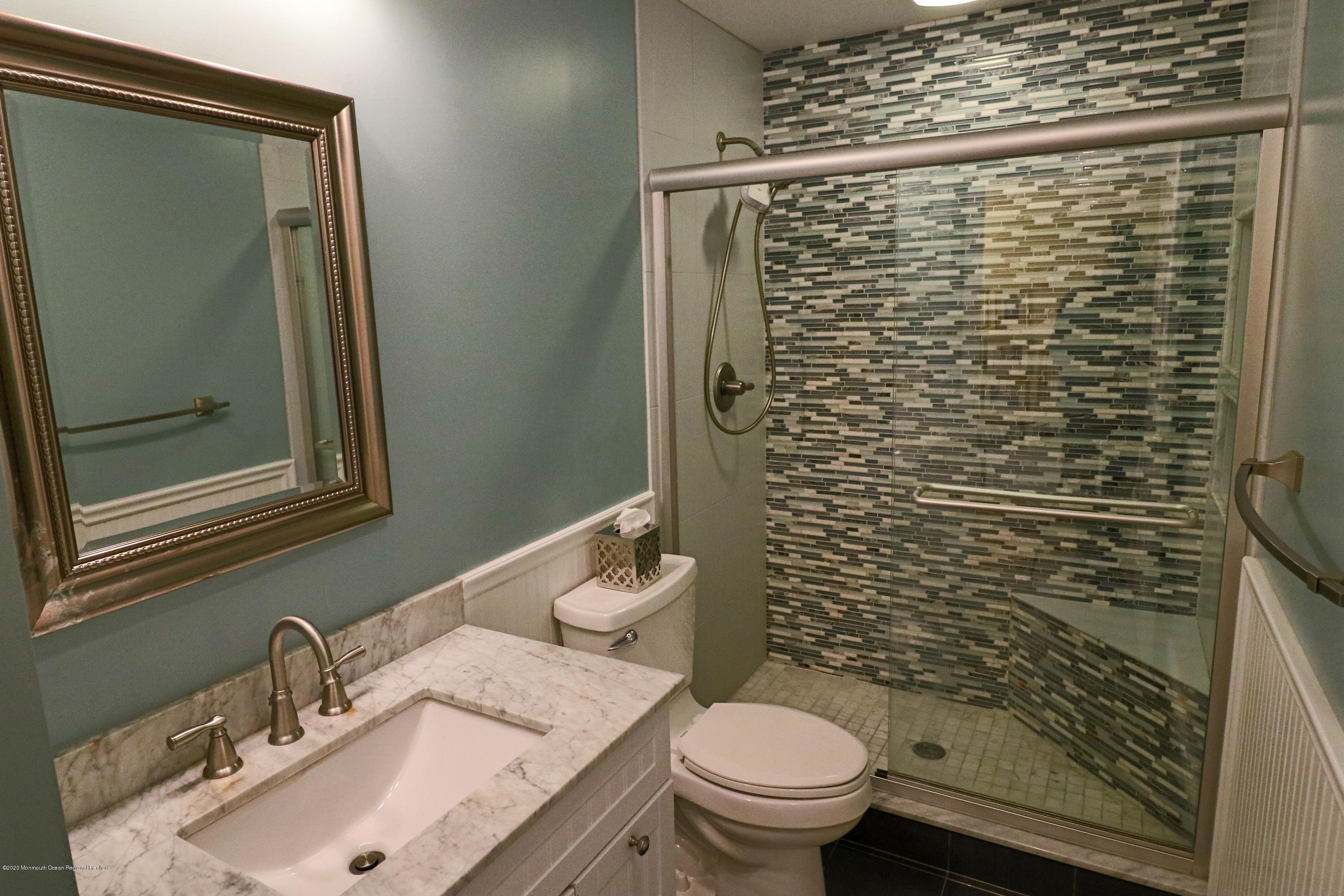 31 Rustic Way Freehold, NJ 07728 - Photo 33 of 62 a bathroom with a sink toilet and shower