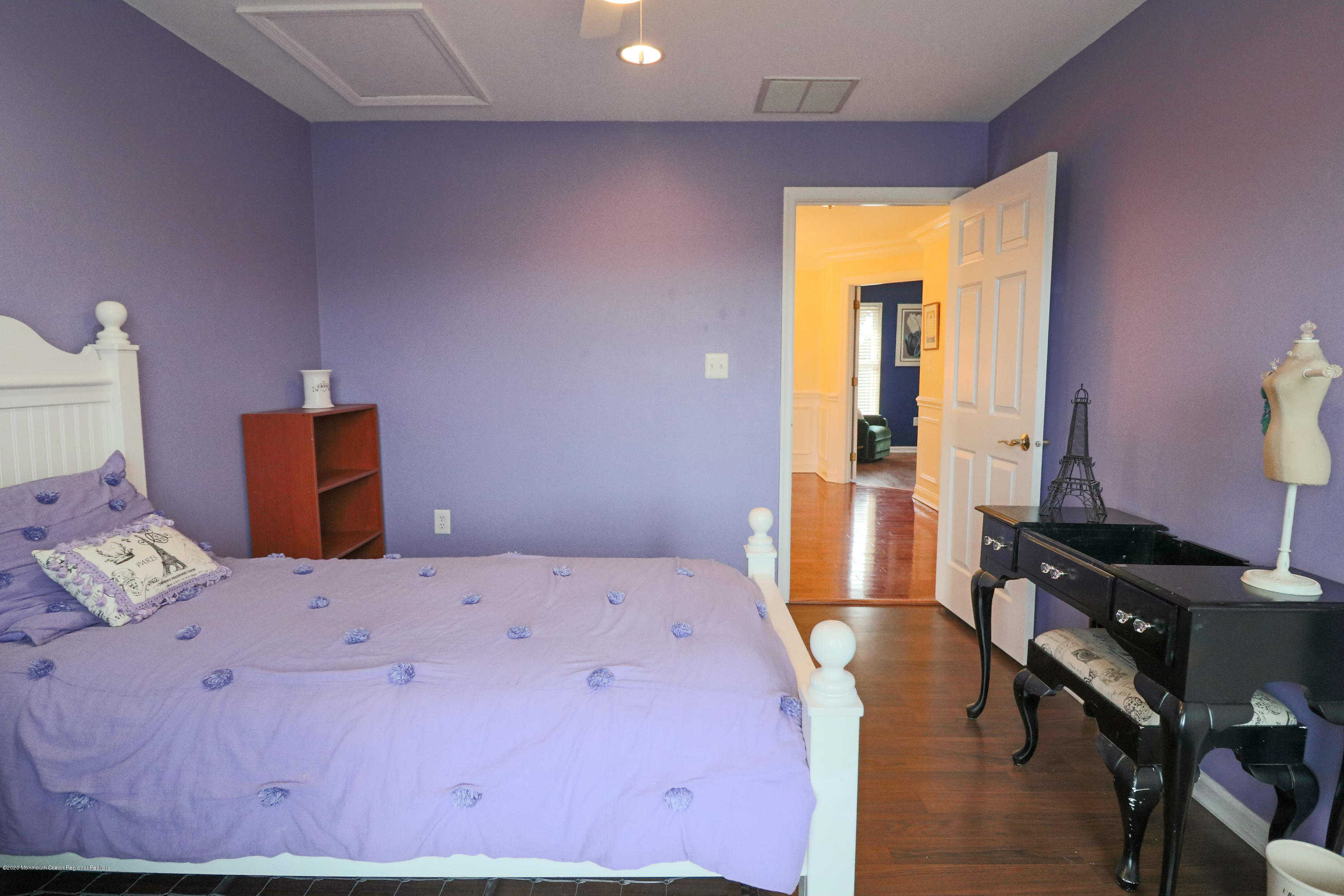 31 Rustic Way Freehold, NJ 07728 - Photo 36 of 62 a bedroom with a bed and wooden floor