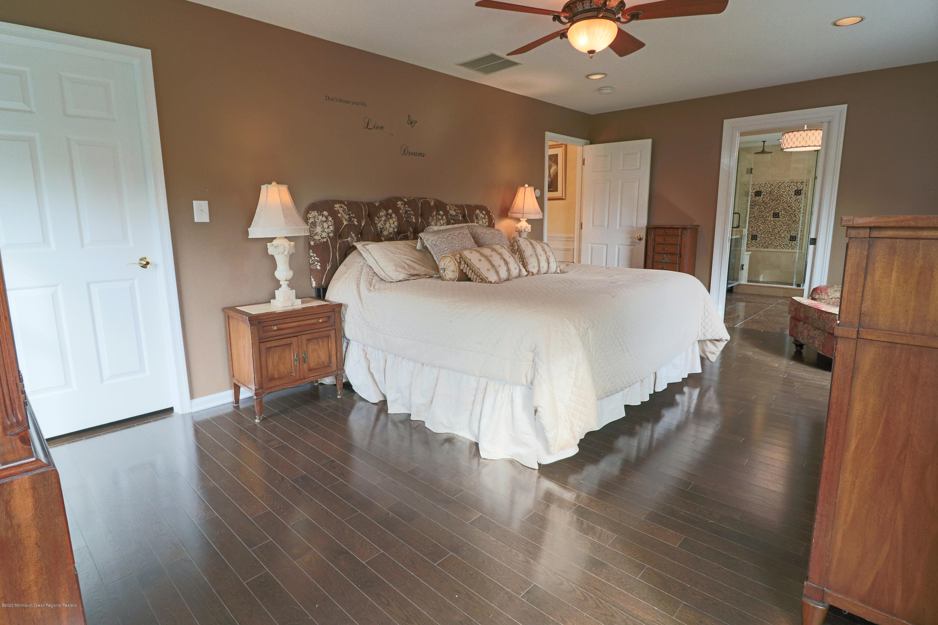 31 Rustic Way Freehold, NJ 07728 - Photo 40 of 62 a bedroom with a bed and wooden floor