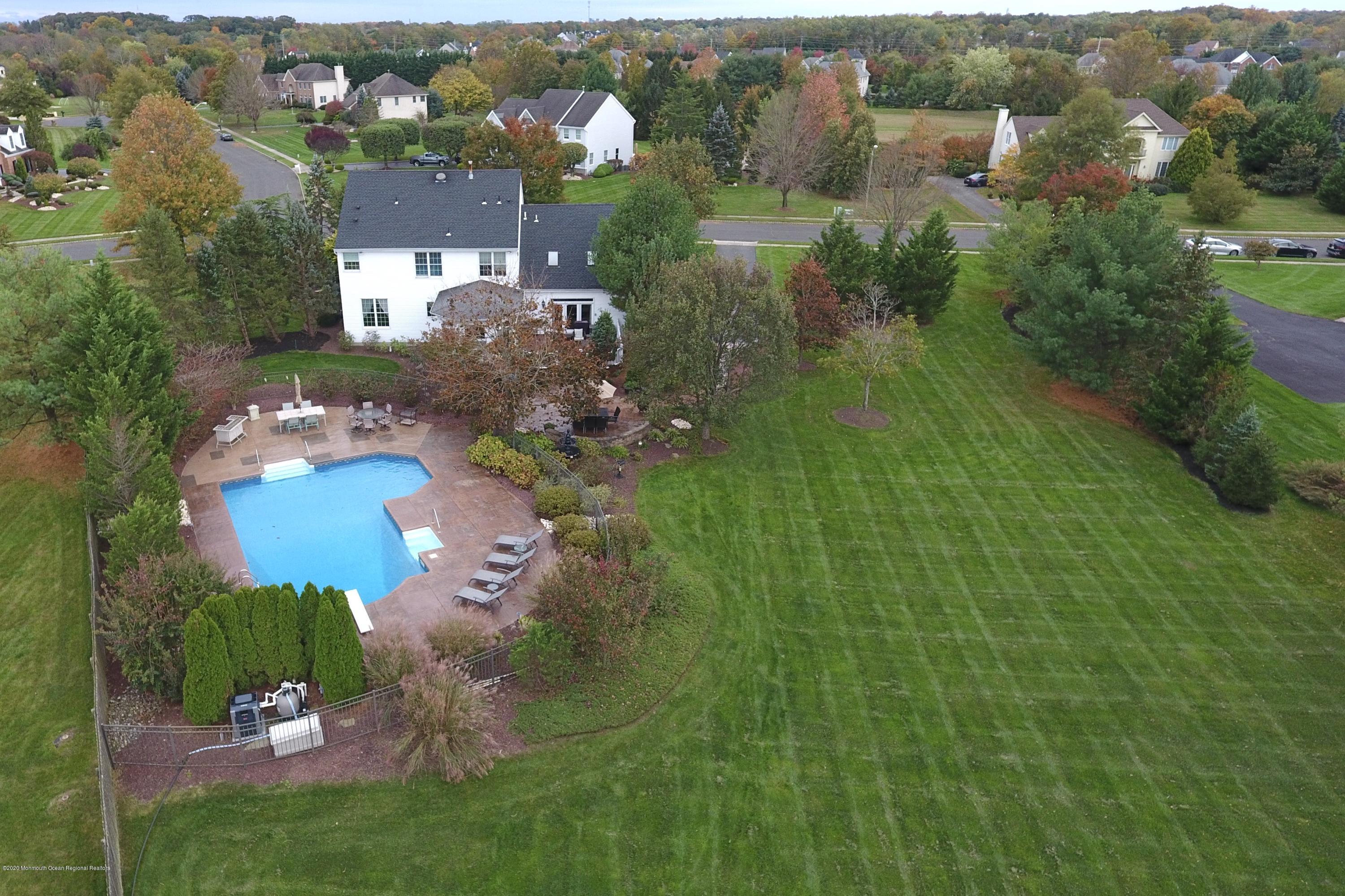 31 Rustic Way Freehold, NJ 07728 - Photo 5 of 62 an aerial view of a house with a yard