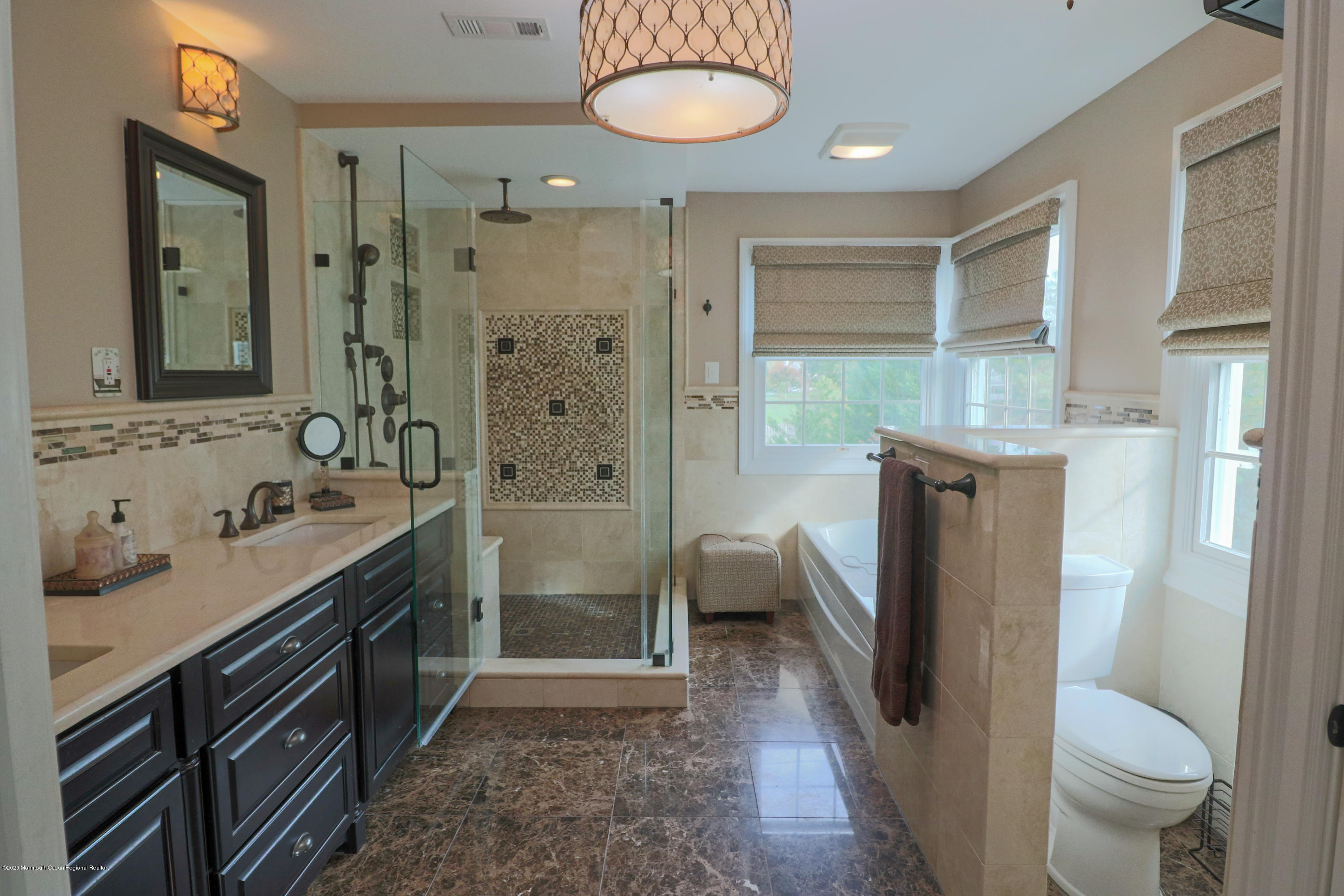 31 Rustic Way Freehold, NJ 07728 - Photo 41 of 62 a bathroom with a sink a toilet and shower