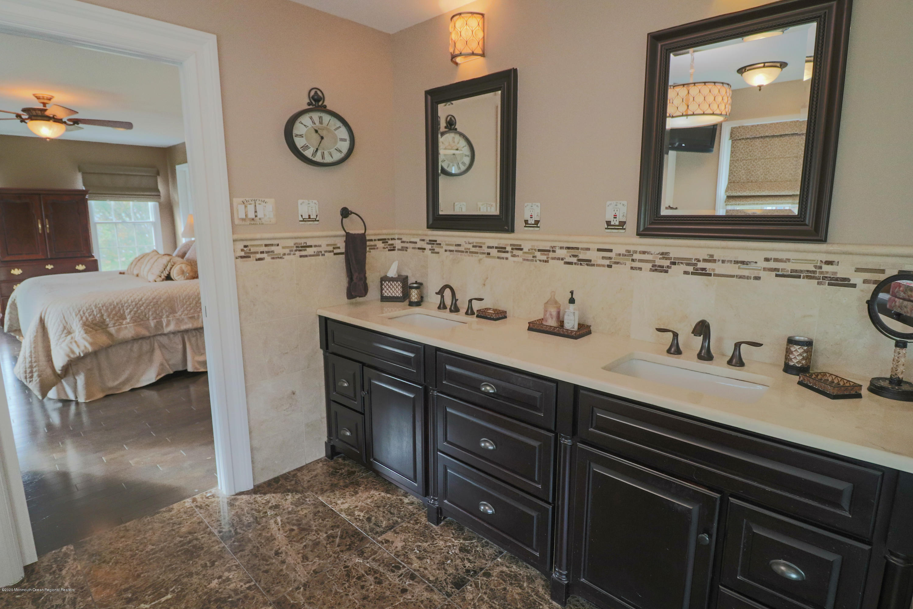 31 Rustic Way Freehold, NJ 07728 - Photo 44 of 62 a bathroom with a sink and a mirror