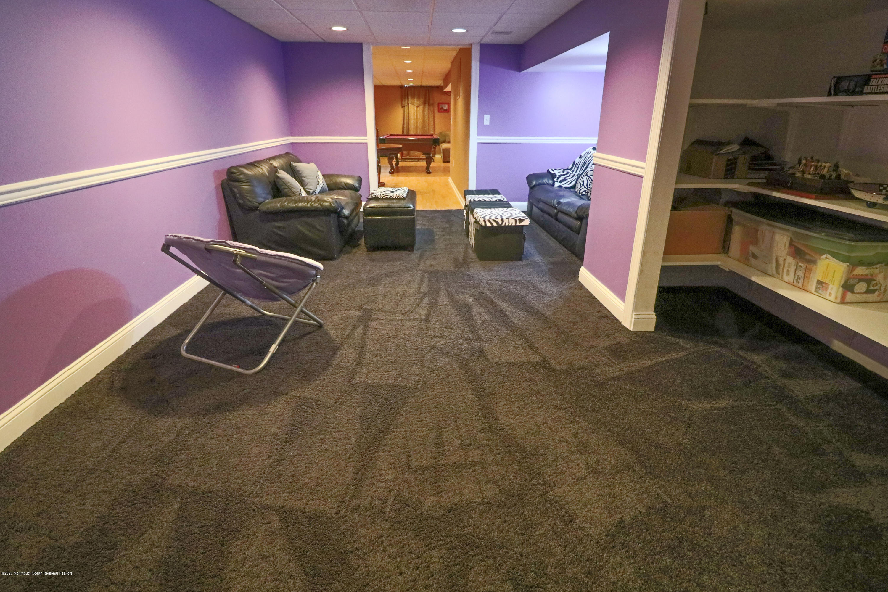 31 Rustic Way Freehold, NJ 07728 - Photo 51 of 62 a living room with furniture a rug and a stove