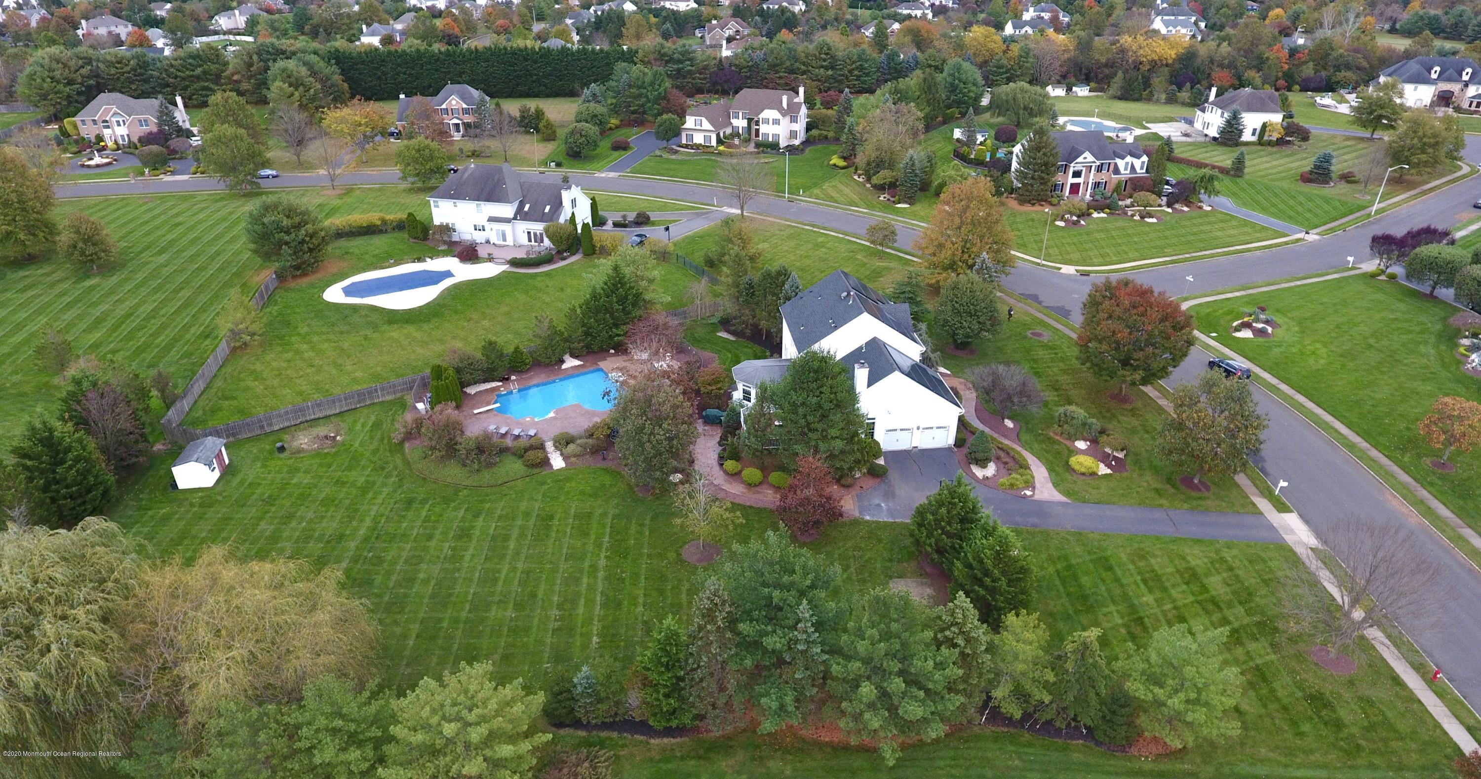 31 Rustic Way Freehold, NJ 07728 - Photo 7 of 62 an aerial view of a house