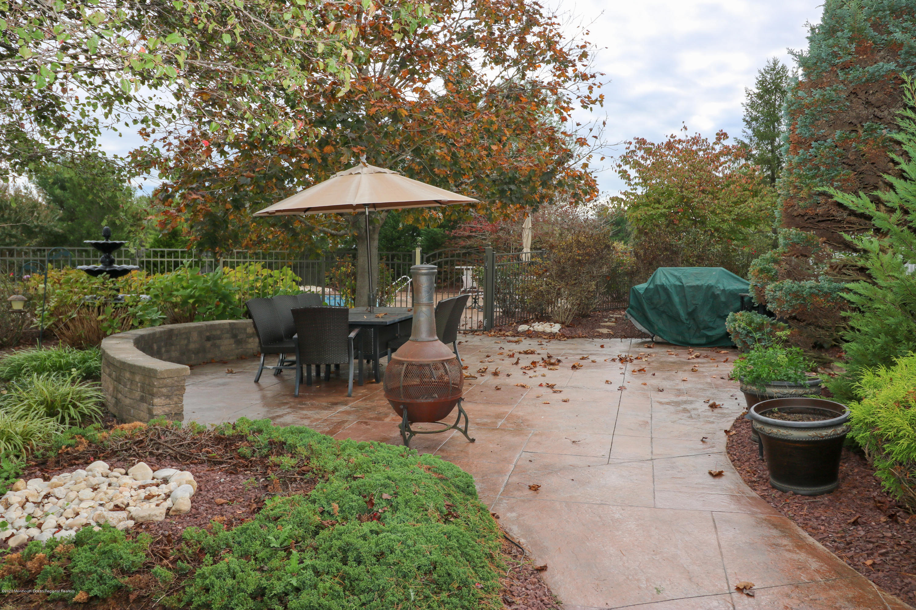 31 Rustic Way Freehold, NJ 07728 - Photo 62 of 62 a view of a backyard with furniture and a garden