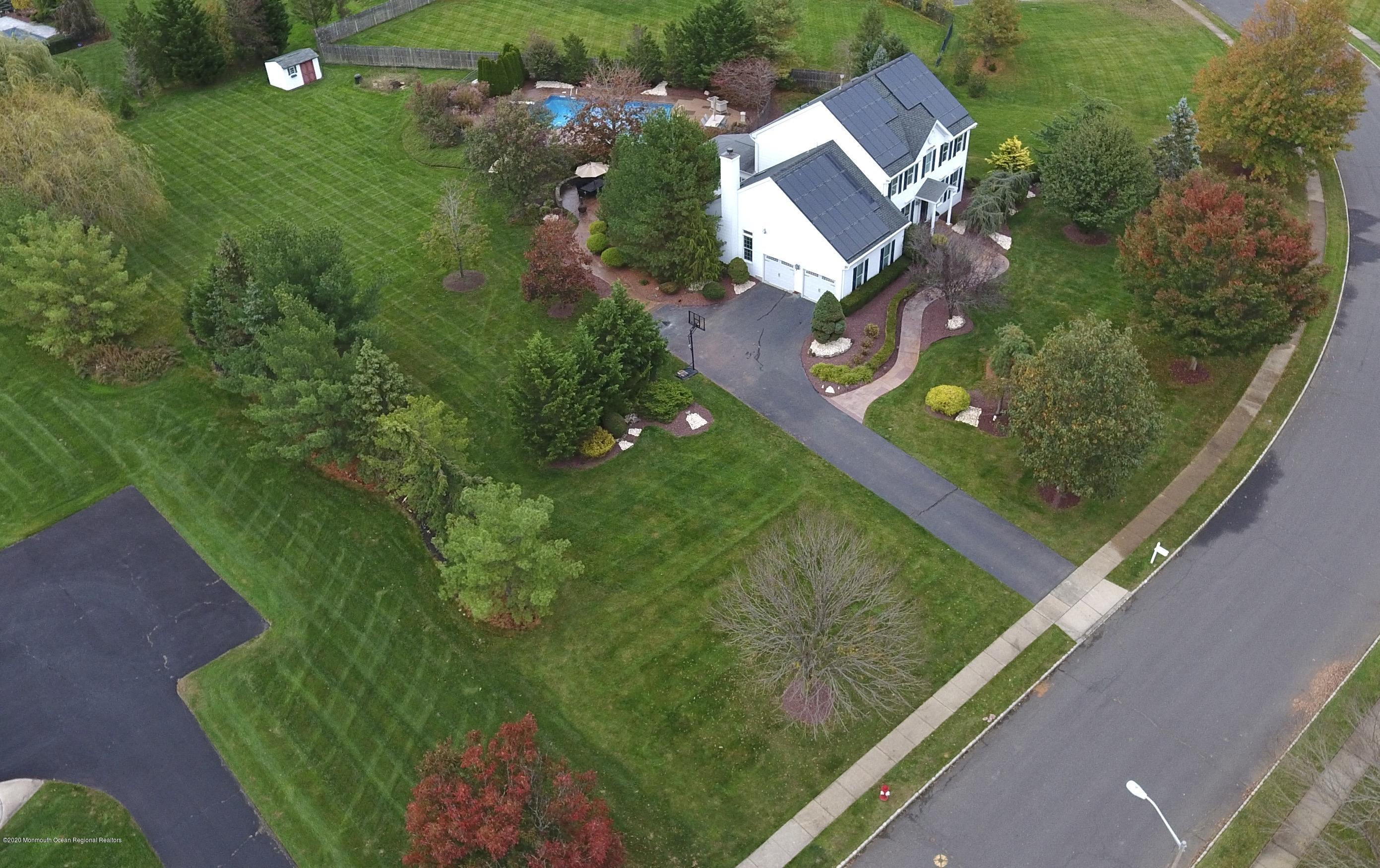 31 Rustic Way Freehold, NJ 07728 - Photo 8 of 62 an aerial view of a residential houses with outdoor space and street view
