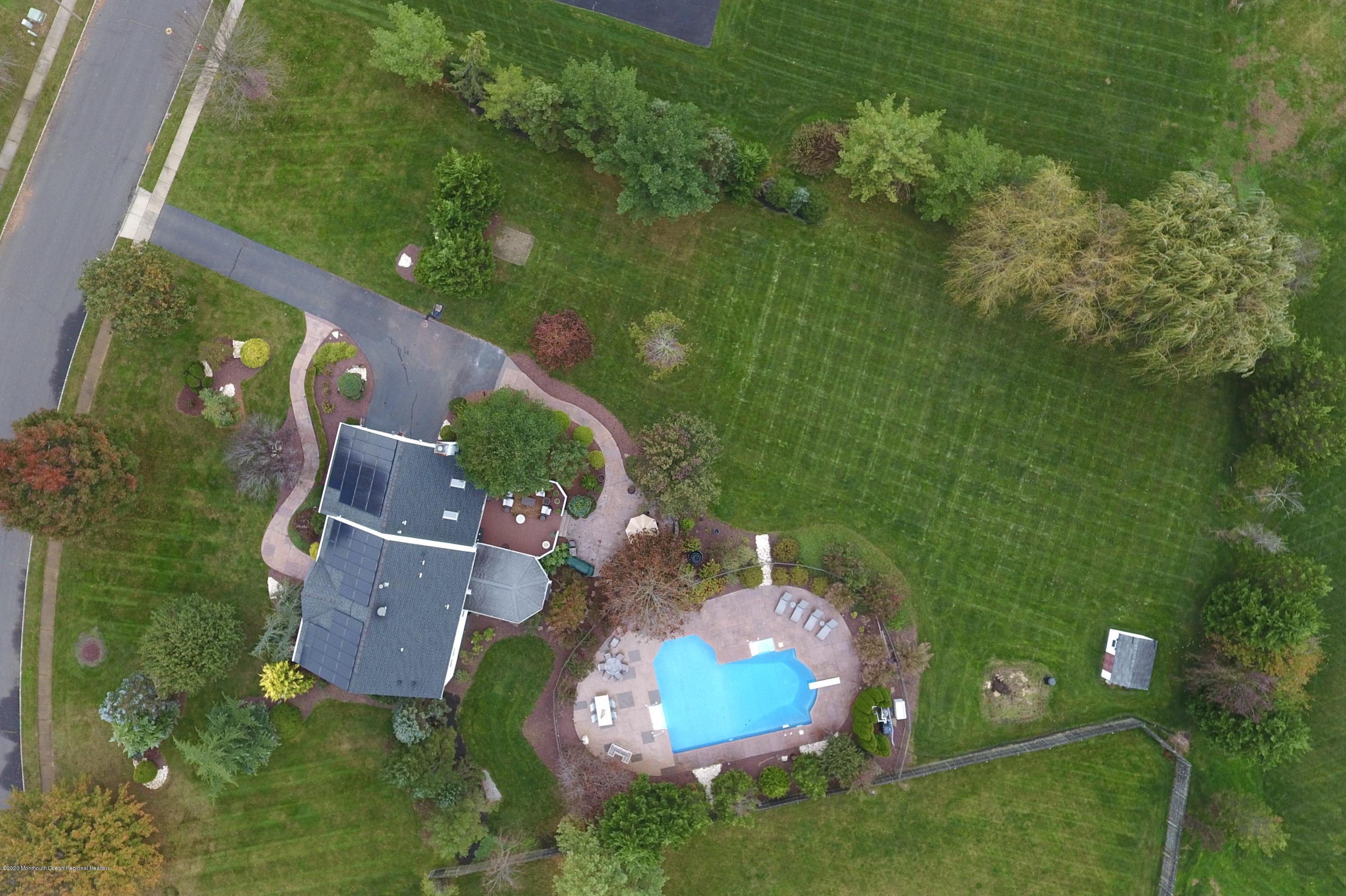 31 Rustic Way Freehold, NJ 07728 - Photo 10 of 62 an aerial view of a house with a yard basket ball court and outdoor seating