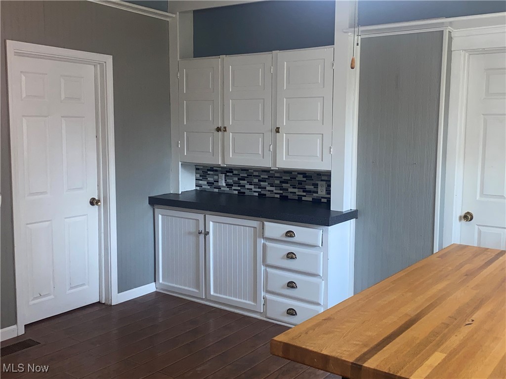 3016 Wadsworth Road Norton, OH 44203 - Photo 10 of 50 Kitchen with white cabinets and LVP flooring