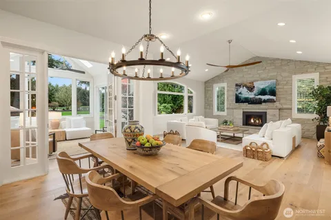 a view of a dining room with furniture wooden floor and chandelier