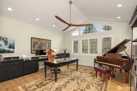 a work room with furniture and wooden floor