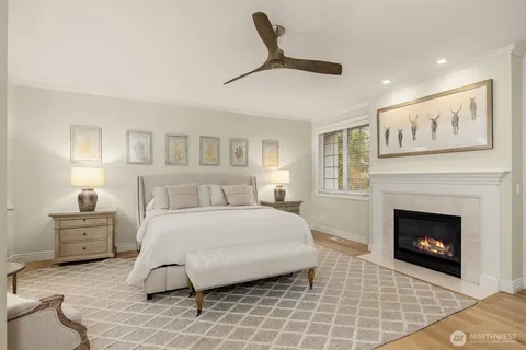 a spacious bedroom with a bed and a fireplace