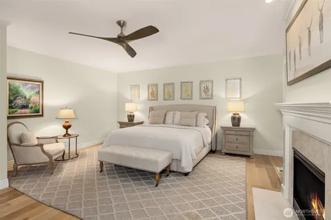 a bedroom with a bed and a fireplace