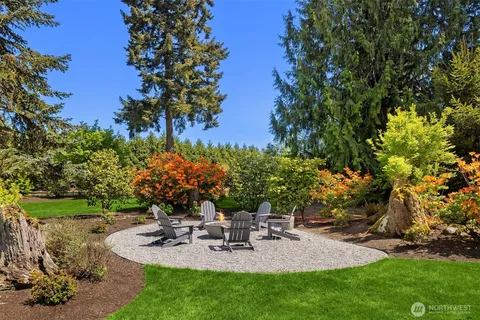 a view of a backyard with sitting area