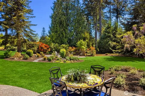 a view of a table and chairs in the garden