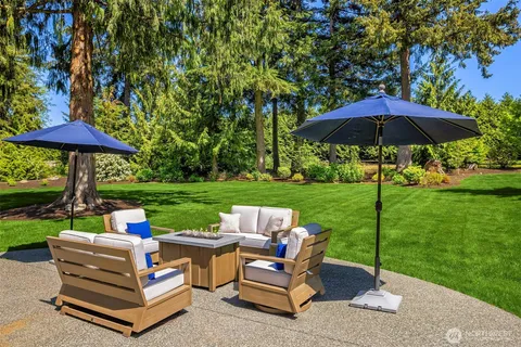 a view of a table and chairs under an umbrella
