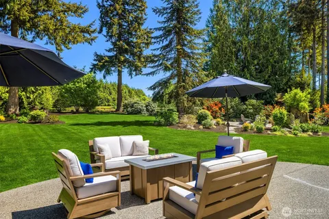 a view of a table and chairs under an umbrella