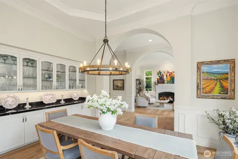 a dining room with furniture and chandelier