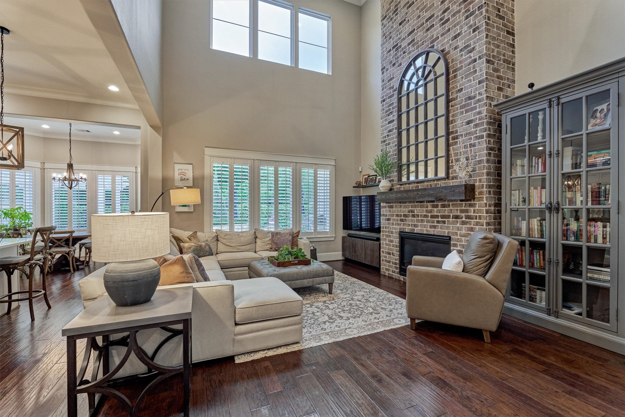 2227 Blue Duck Lane Conroe, TX 77384 - Photo 12 of 50 a living room with fireplace furniture and a large window