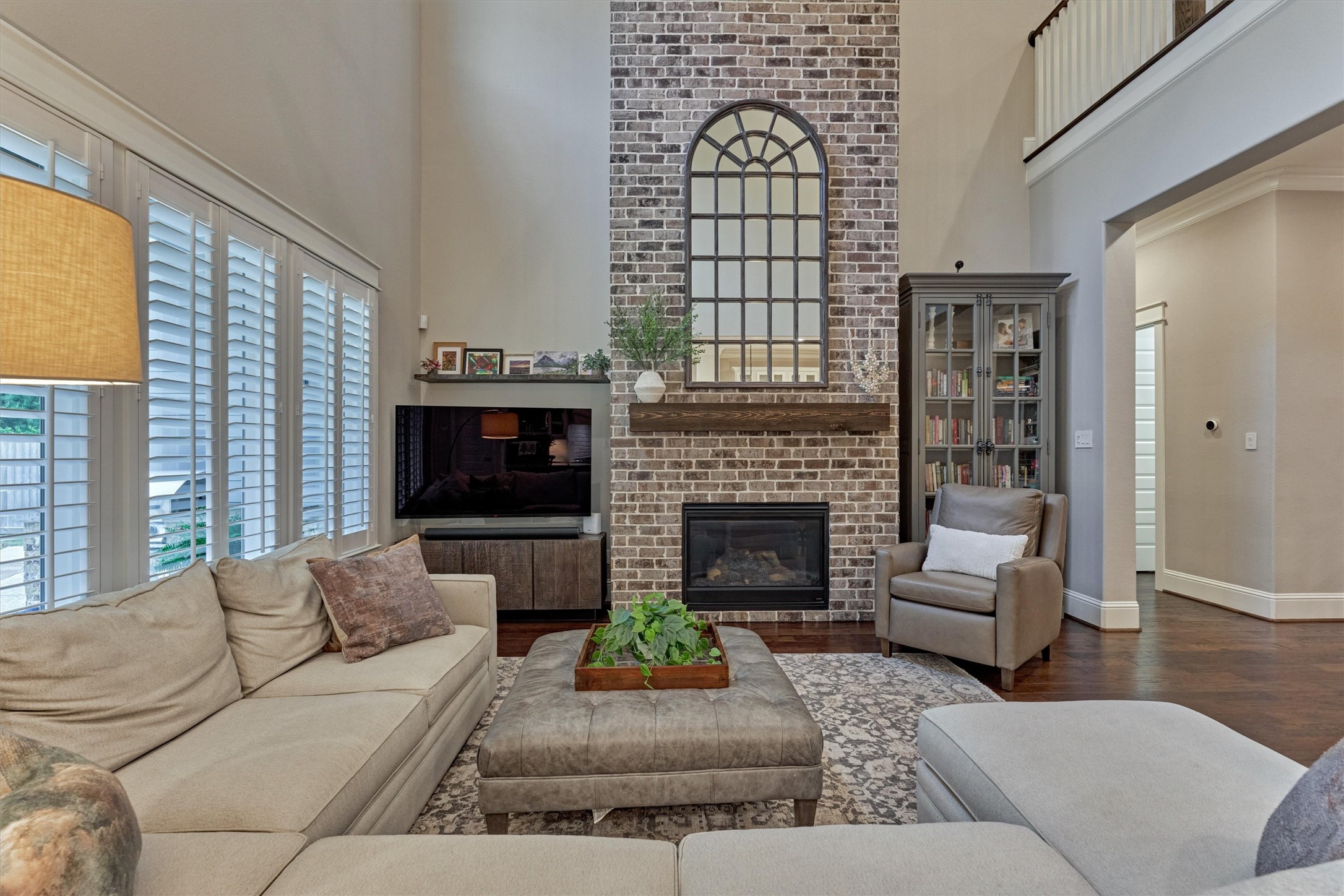 2227 Blue Duck Lane Conroe, TX 77384 - Photo 13 of 50 a living room with furniture a fireplace and a flat screen tv