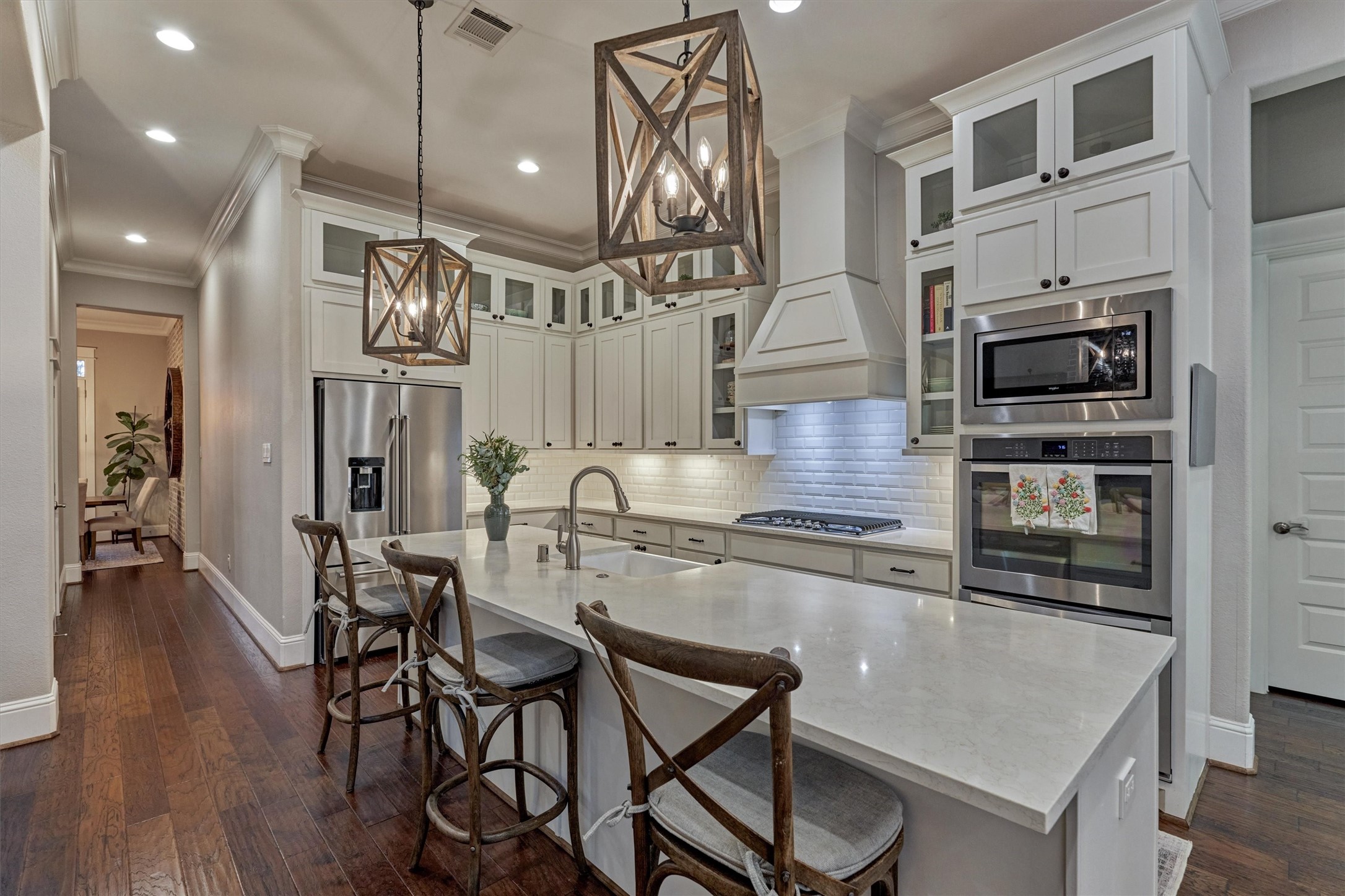 2227 Blue Duck Lane Conroe, TX 77384 - Photo 17 of 50 a kitchen with sink cabinets and stainless steel appliances