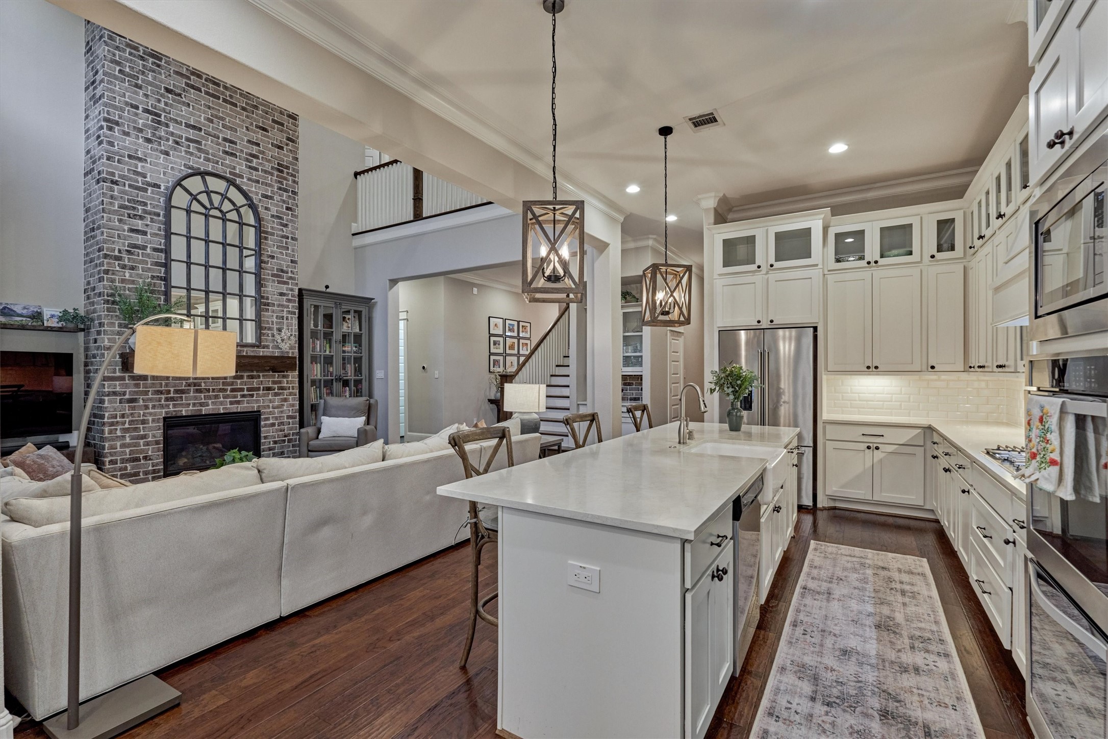 2227 Blue Duck Lane Conroe, TX 77384 - Photo 18 of 50 a kitchen with a stove a sink and a refrigerator