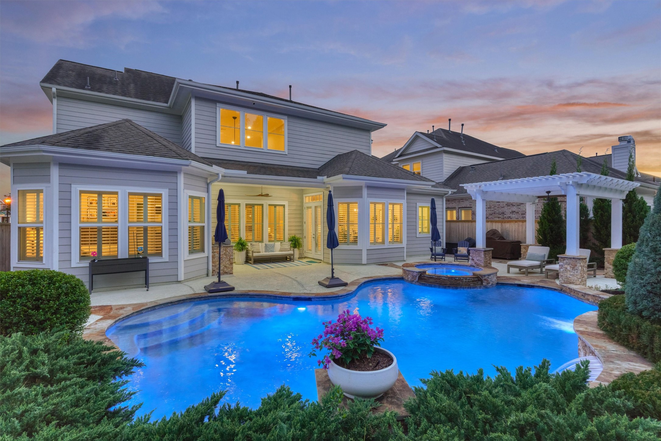 2227 Blue Duck Lane Conroe, TX 77384 - Photo 2 of 50 a view of a house with swimming pool patio and outdoor seating