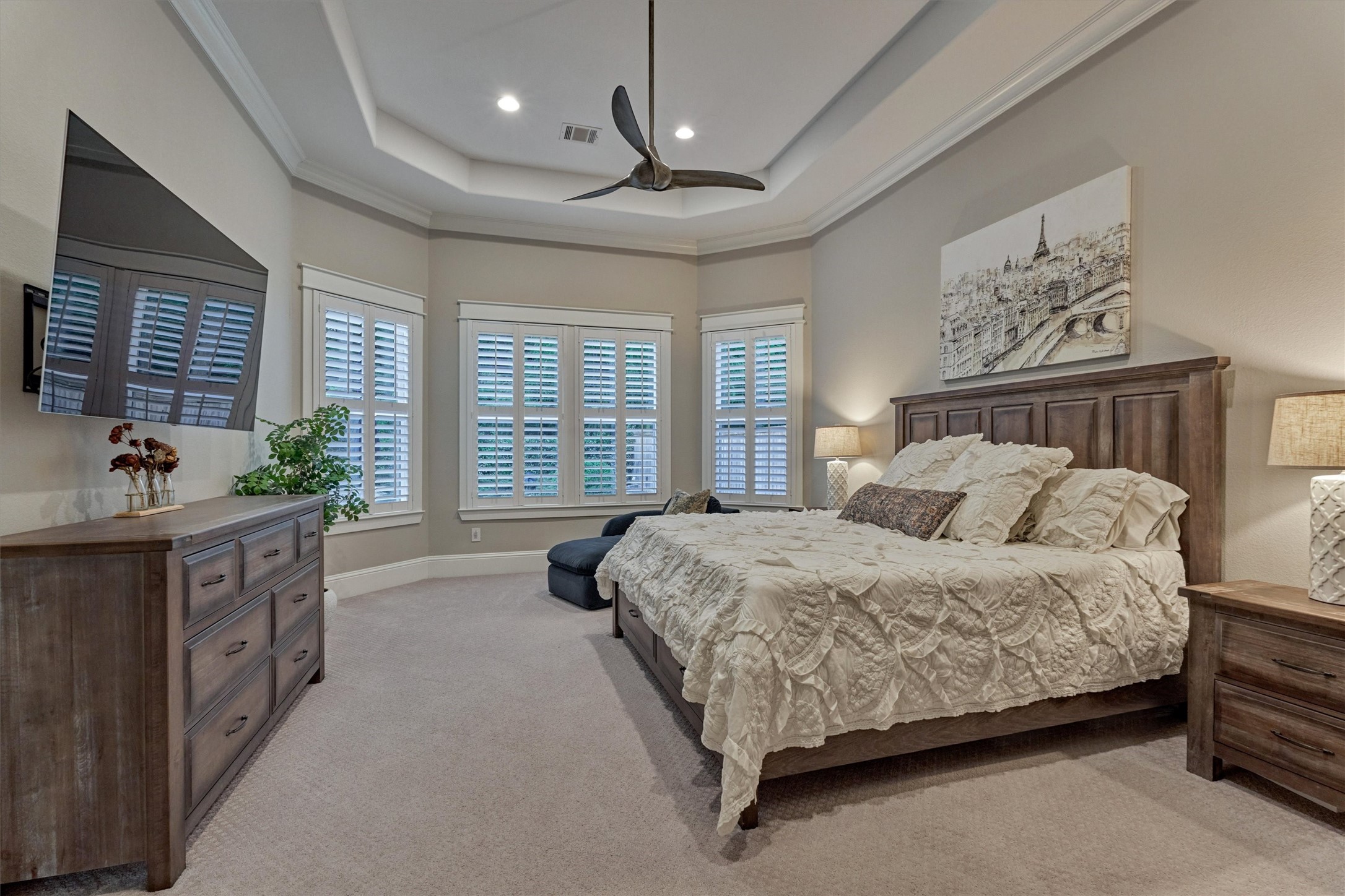 2227 Blue Duck Lane Conroe, TX 77384 - Photo 23 of 50 a spacious bedroom with a large bed and a chandelier