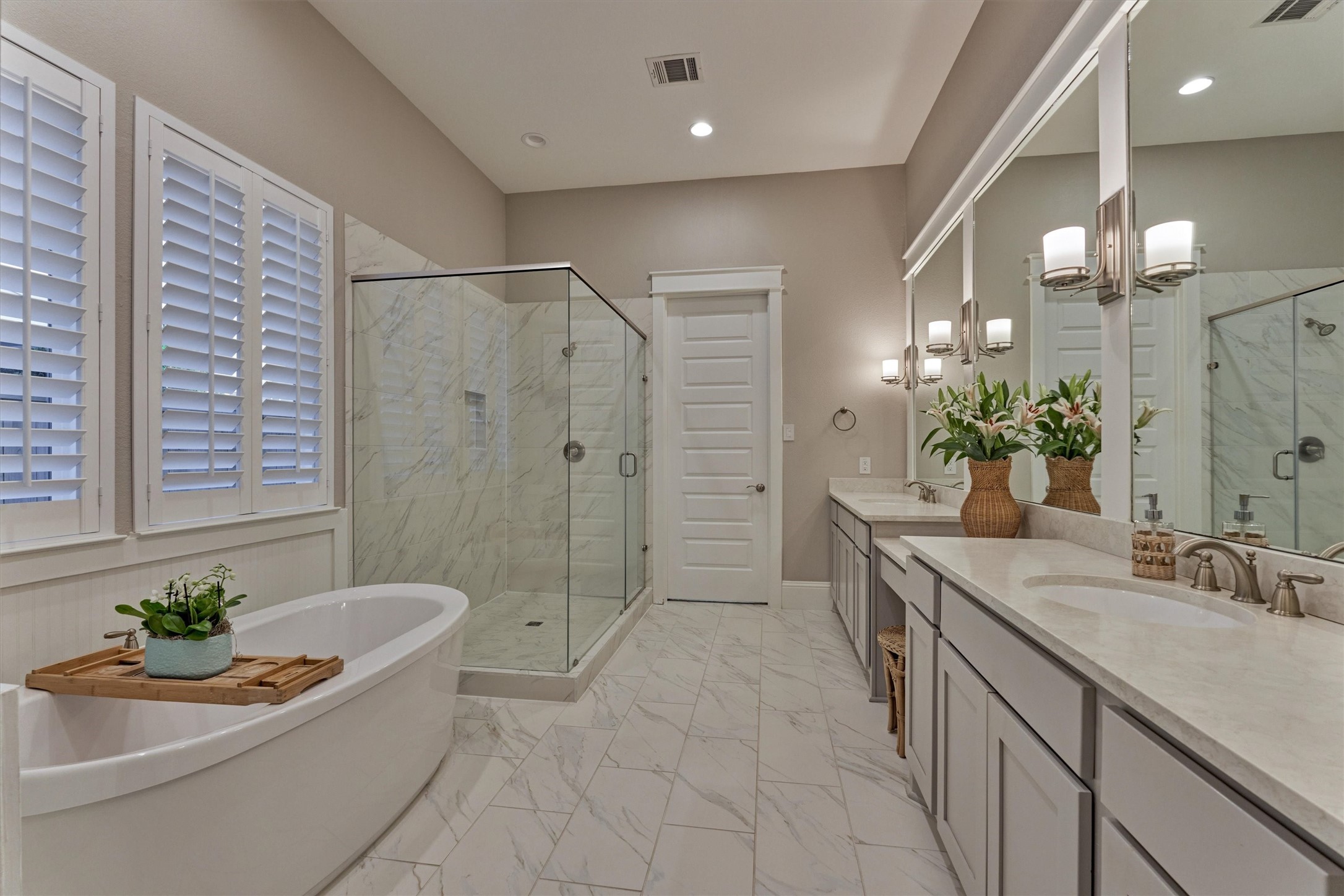2227 Blue Duck Lane Conroe, TX 77384 - Photo 25 of 50 a spacious bathroom with a granite countertop sink a mirror a bathtub and a shower