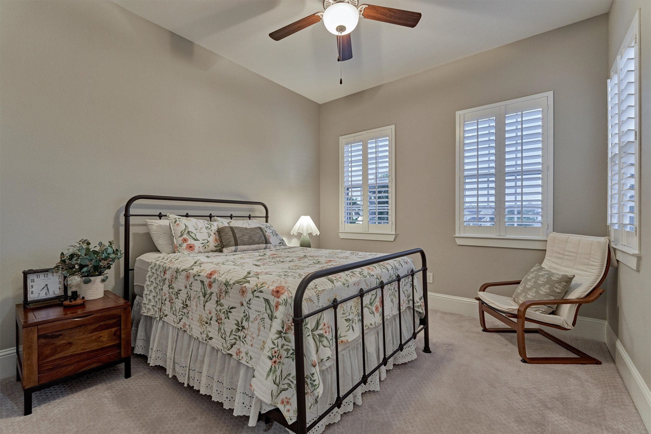 2227 Blue Duck Lane Conroe, TX 77384 - Photo 29 of 50 a bedroom with a bed and a chandelier