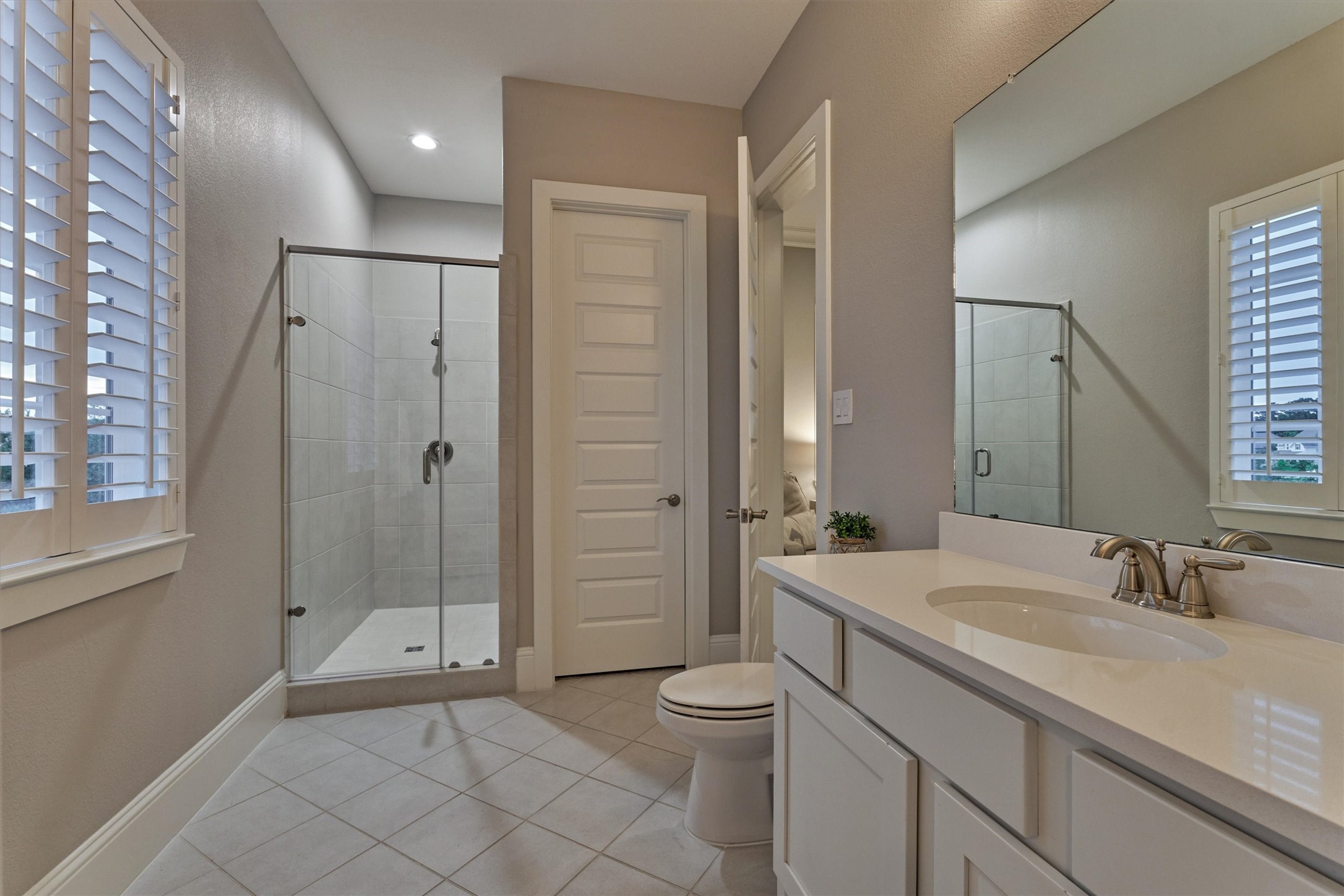 2227 Blue Duck Lane Conroe, TX 77384 - Photo 30 of 50 a bathroom with a sink a toilet and shower