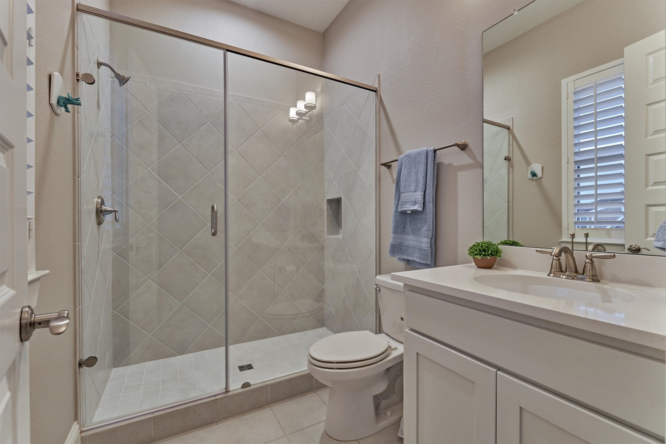 2227 Blue Duck Lane Conroe, TX 77384 - Photo 33 of 50 a bathroom with a sink a toilet and shower