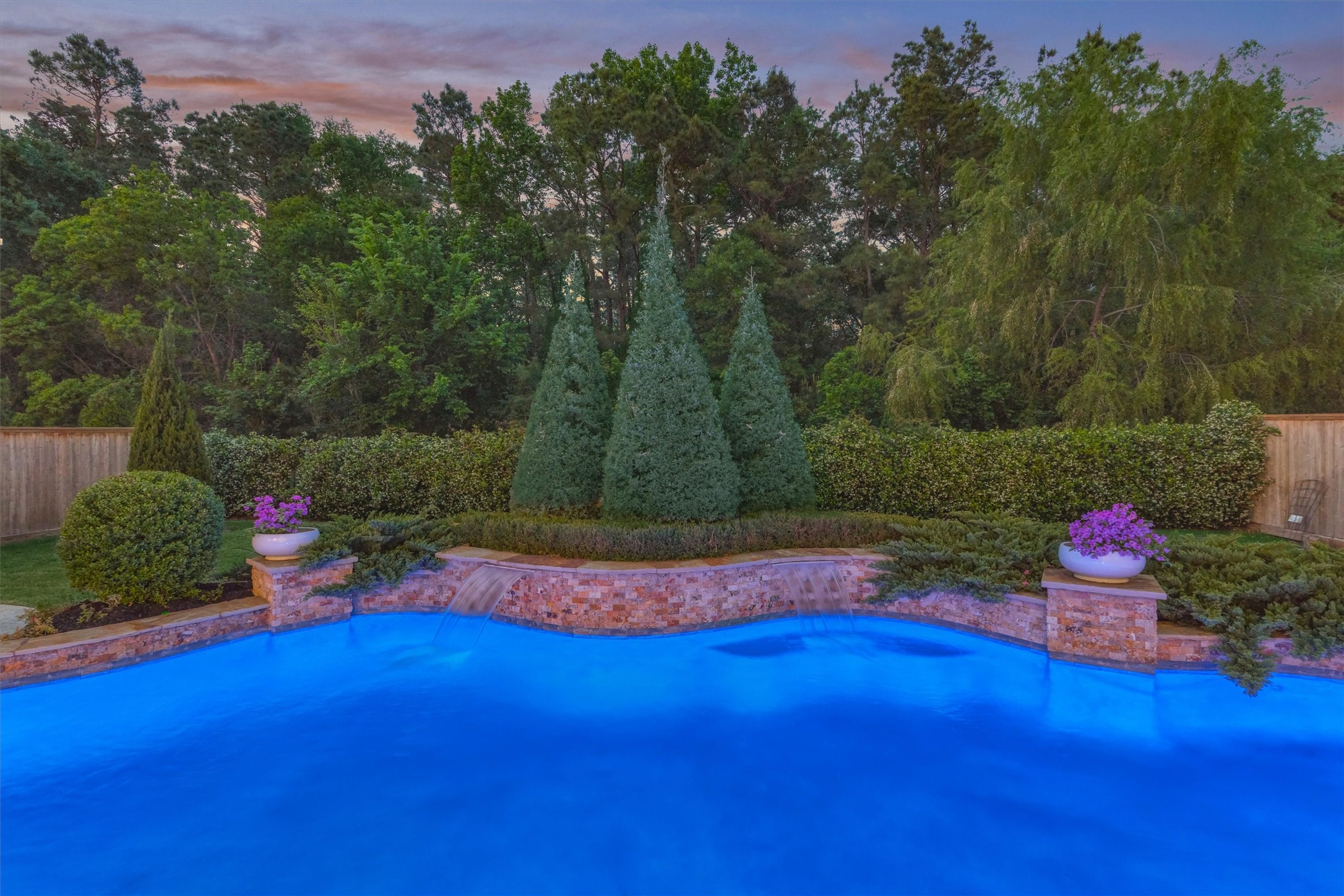 2227 Blue Duck Lane Conroe, TX 77384 - Photo 44 of 50 a backyard of a house with lots of green space and outdoor seating