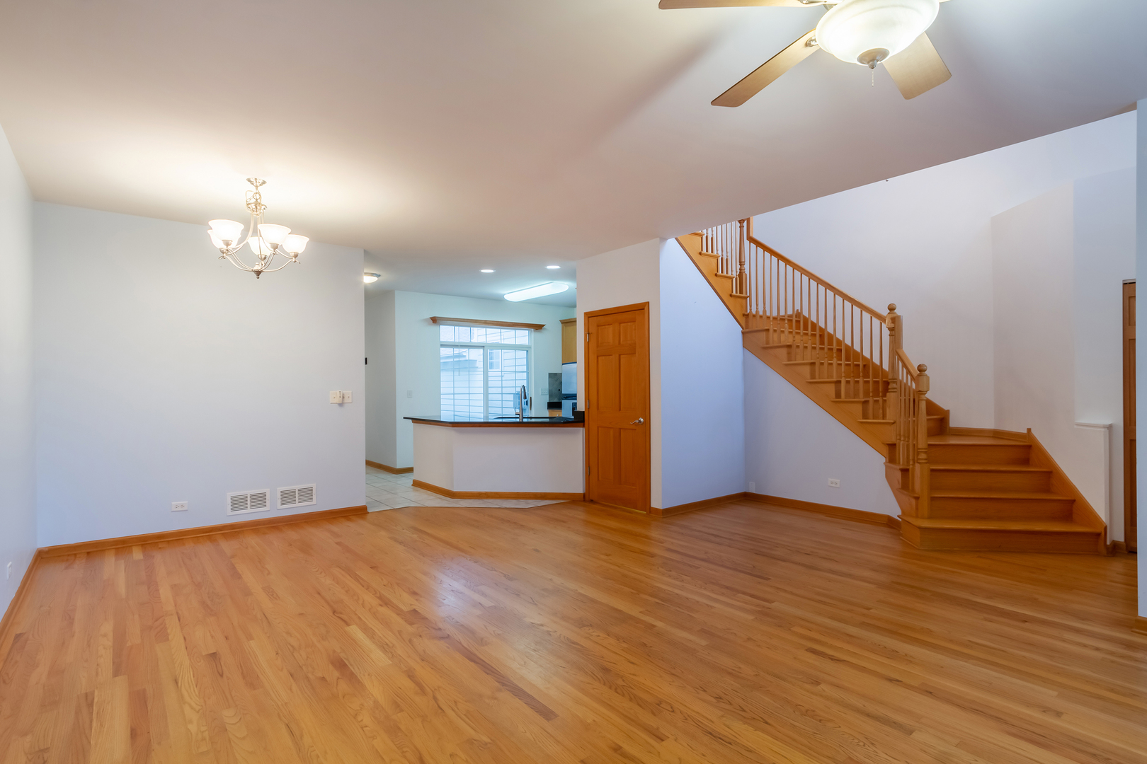 1882 Keystone Place, Unit 1882 Schaumburg, IL 60193 - Photo 11 of 34 a view of an empty room with wooden floor
