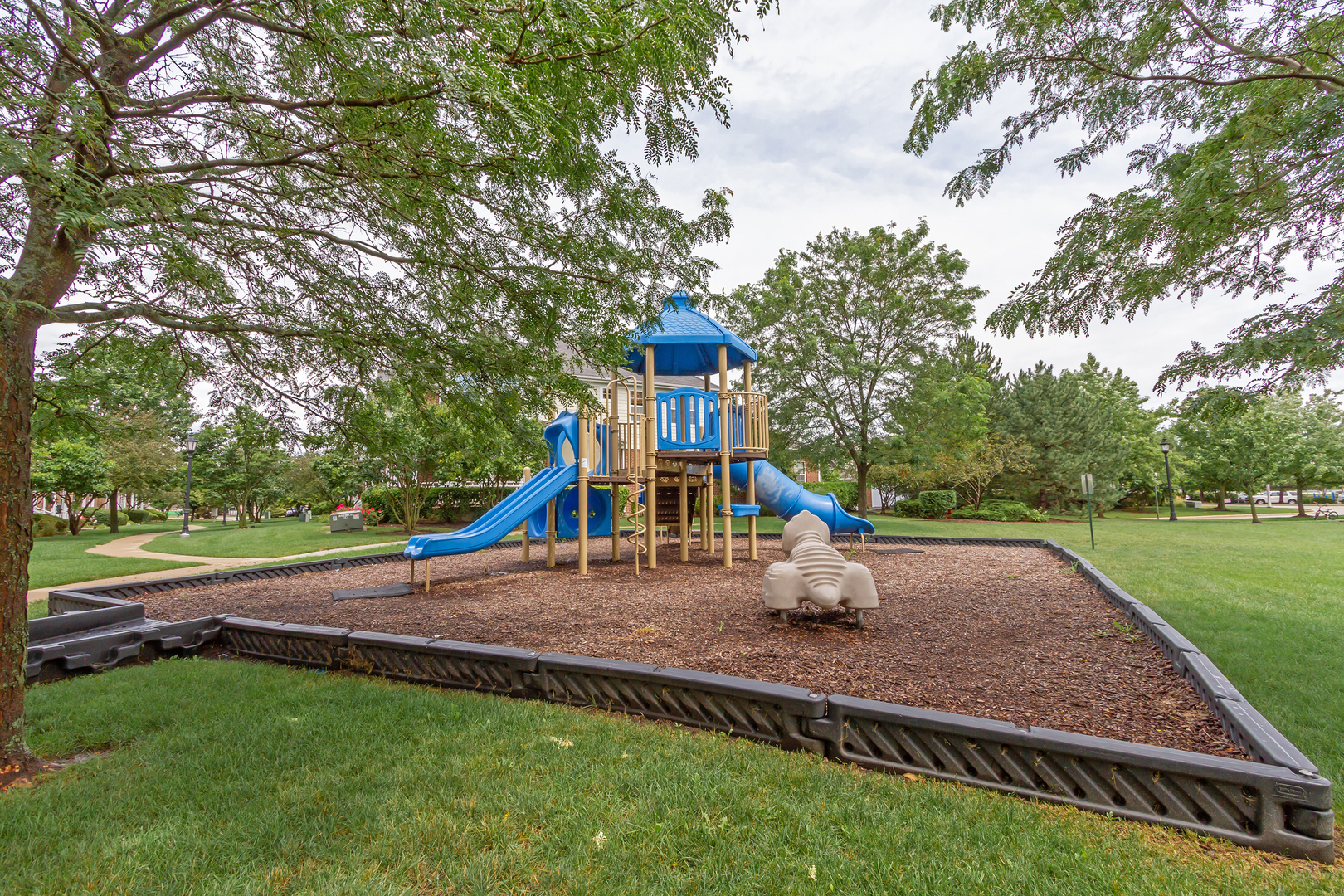 1882 Keystone Place, Unit 1882 Schaumburg, IL 60193 - Photo 31 of 34 a park view with a tree in the background