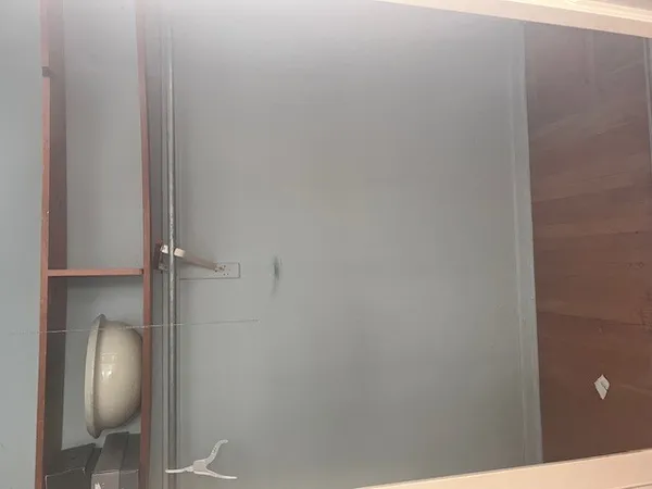 a view of an empty room and window