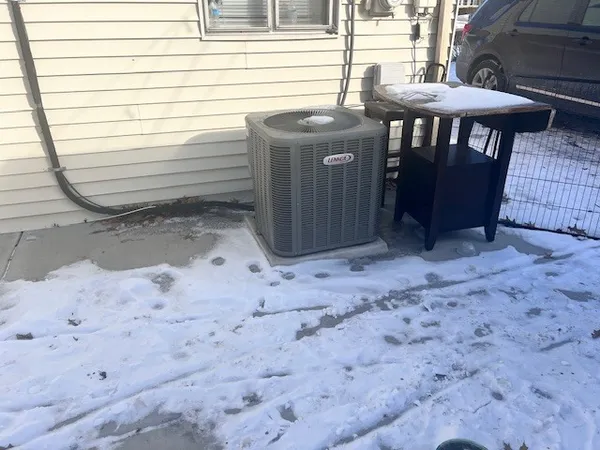 a view of a backyard with a table and chairs