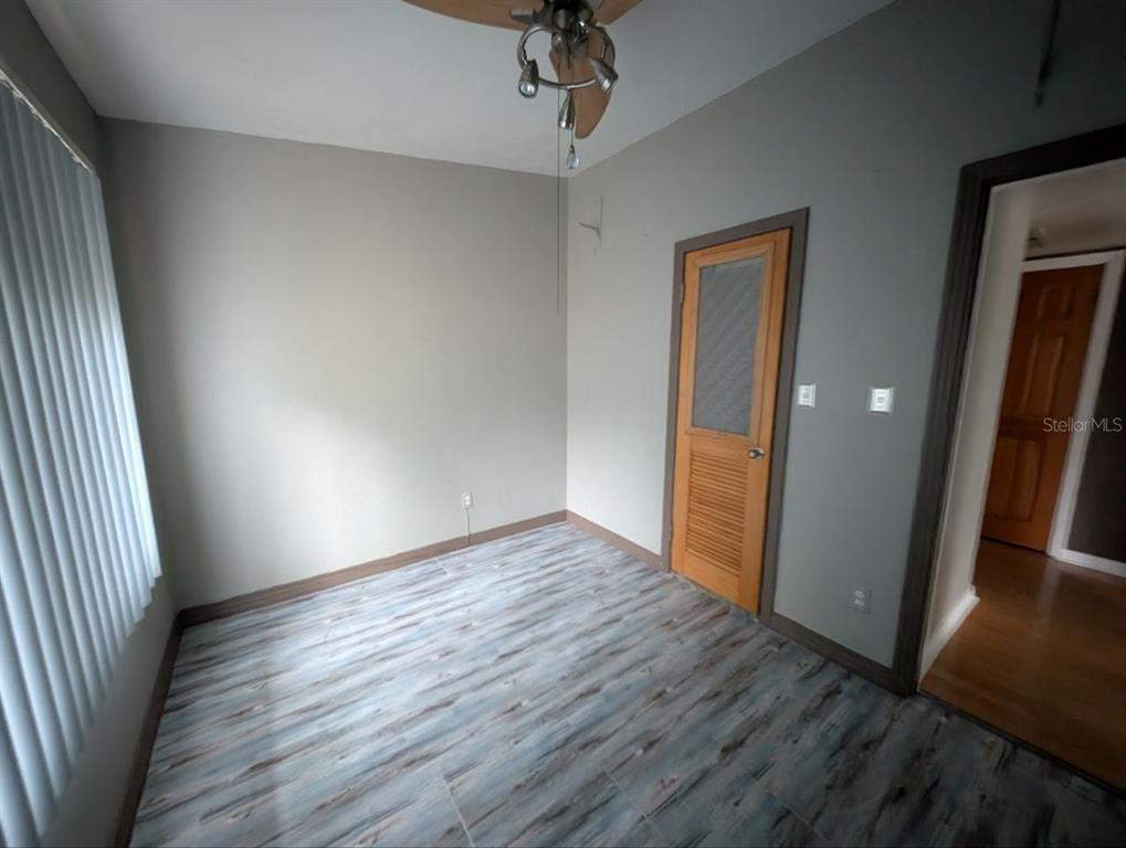 2304 Vine Street Leesburg, FL 34748 - Photo 11 of 25 wooden floor in an empty room with a window