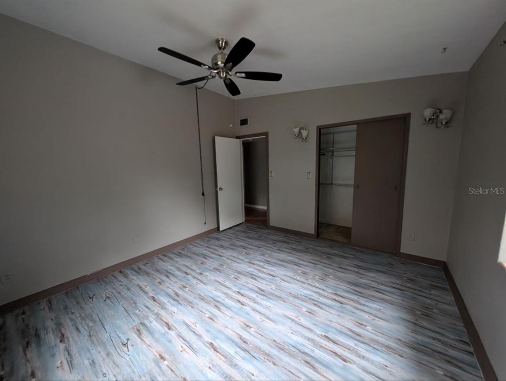 2304 Vine Street Leesburg, FL 34748 - Photo 13 of 25 a view of empty room with wooden floor