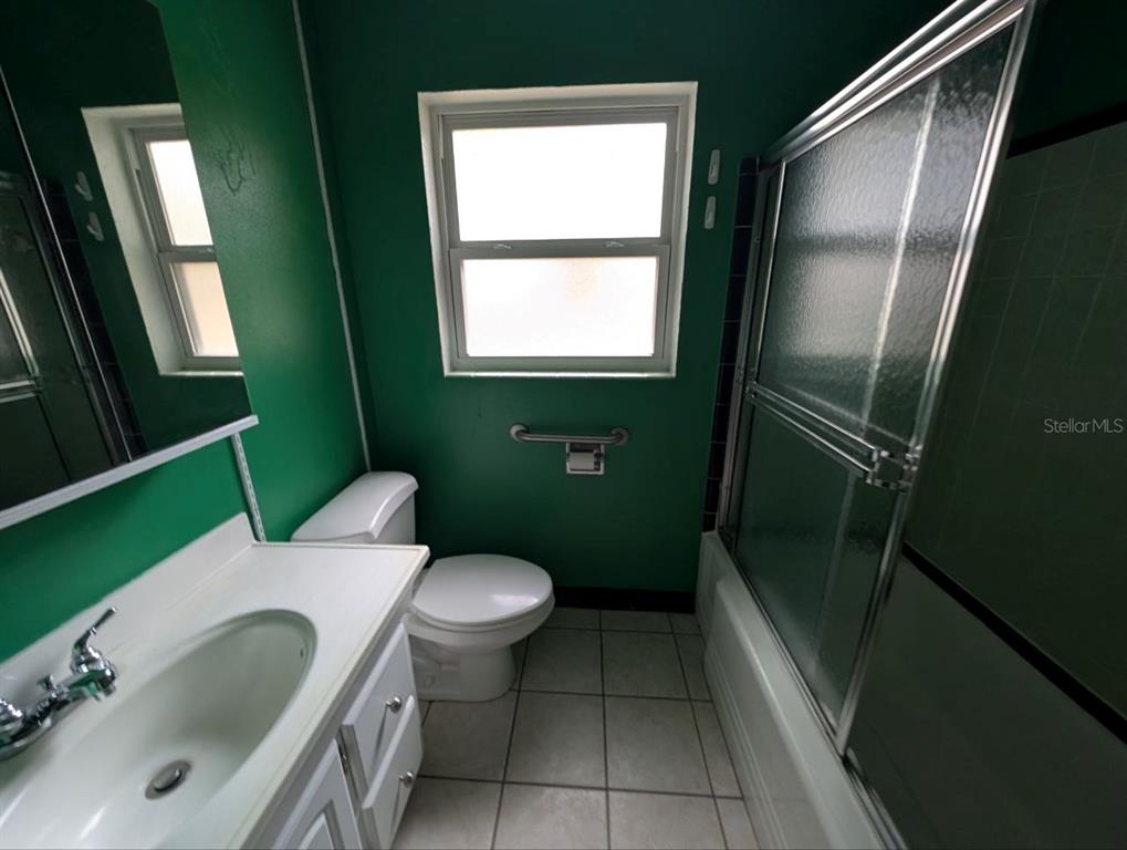 2304 Vine Street Leesburg, FL 34748 - Photo 16 of 25 a bathroom with a sink toilet and mirror