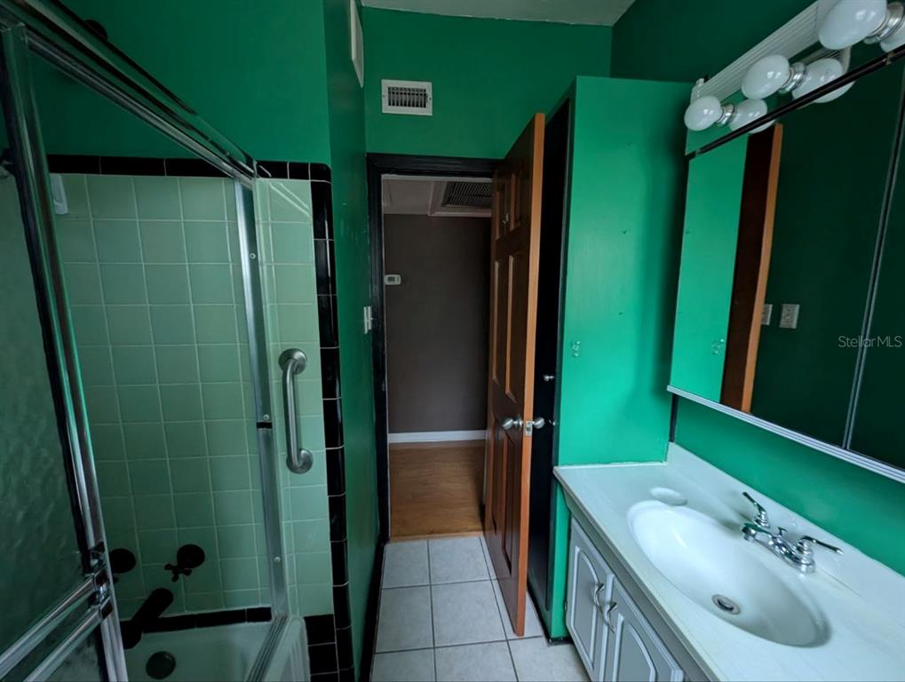 2304 Vine Street Leesburg, FL 34748 - Photo 17 of 25 a bathroom with a sink a toilet and shower