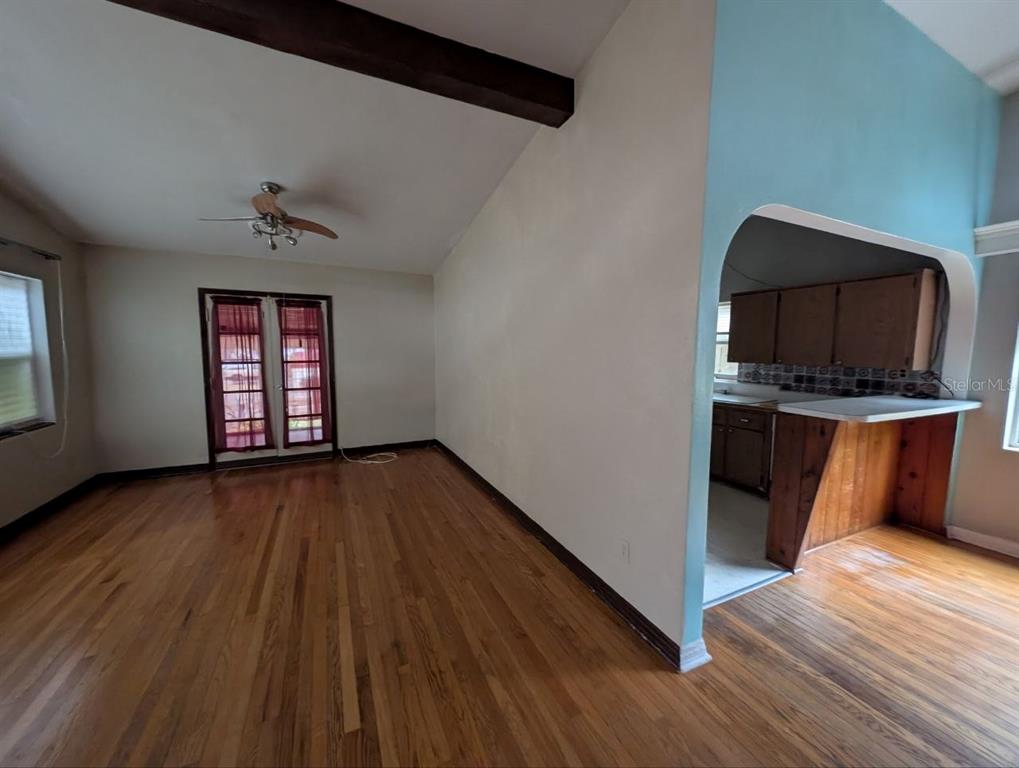 2304 Vine Street Leesburg, FL 34748 - Photo 18 of 25 a view of a kitchen with wooden floor and electronic appliances