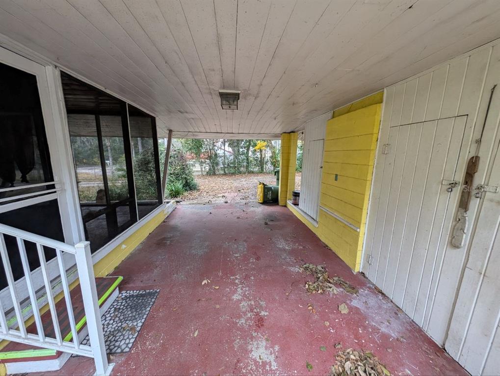 2304 Vine Street Leesburg, FL 34748 - Photo 19 of 25 a view of entryway with a floor to ceiling window and wooden floor