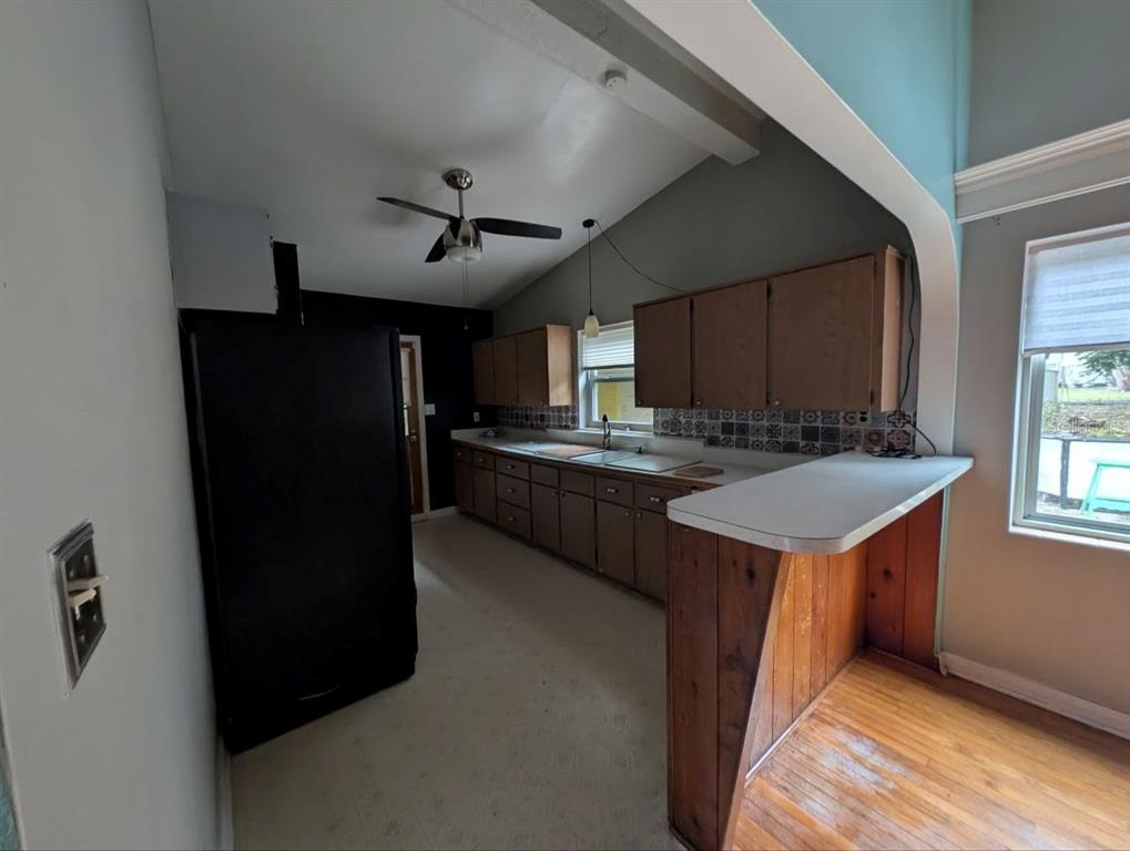 2304 Vine Street Leesburg, FL 34748 - Photo 6 of 25 a kitchen with stainless steel appliances granite countertop a refrigerator a sink and a stove