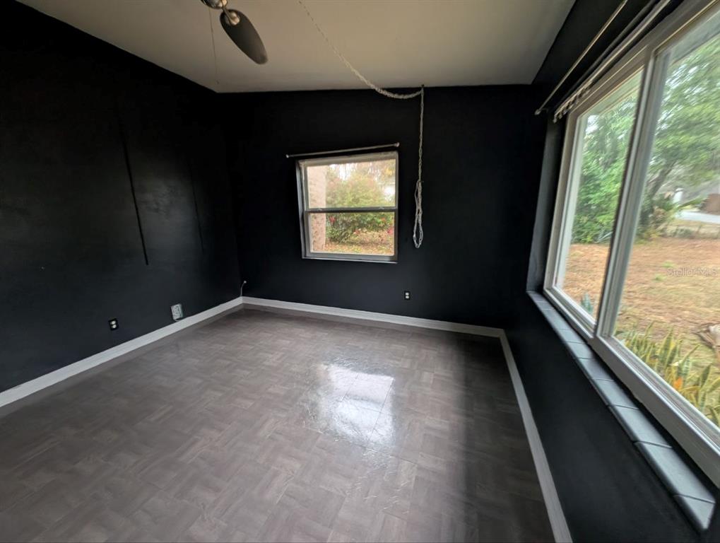 2304 Vine Street Leesburg, FL 34748 - Photo 9 of 25 a view of an empty room with a window