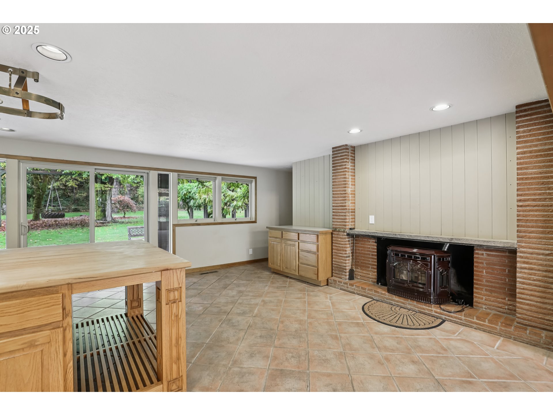 39777 Northwest Murtaugh Road North Plains, OR 97133 - Photo 14 of 45 a living room with furniture a window and a fireplace