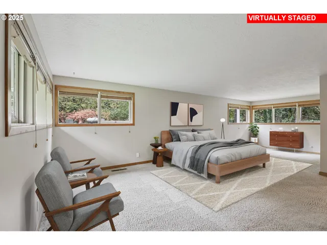 a bedroom with furniture and a window