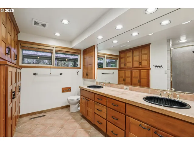 a bathroom with a sink double vanity and a mirror