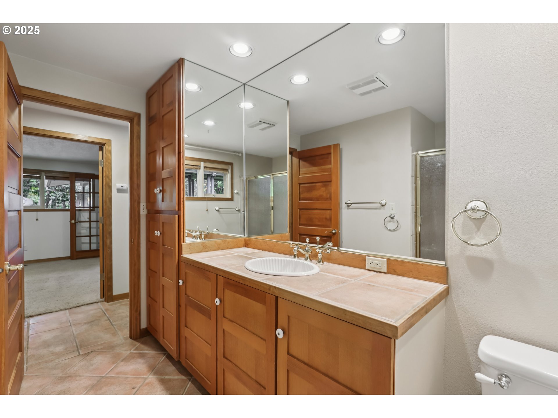 39777 Northwest Murtaugh Road North Plains, OR 97133 - Photo 26 of 45 a bathroom with a sink a mirror and a shower
