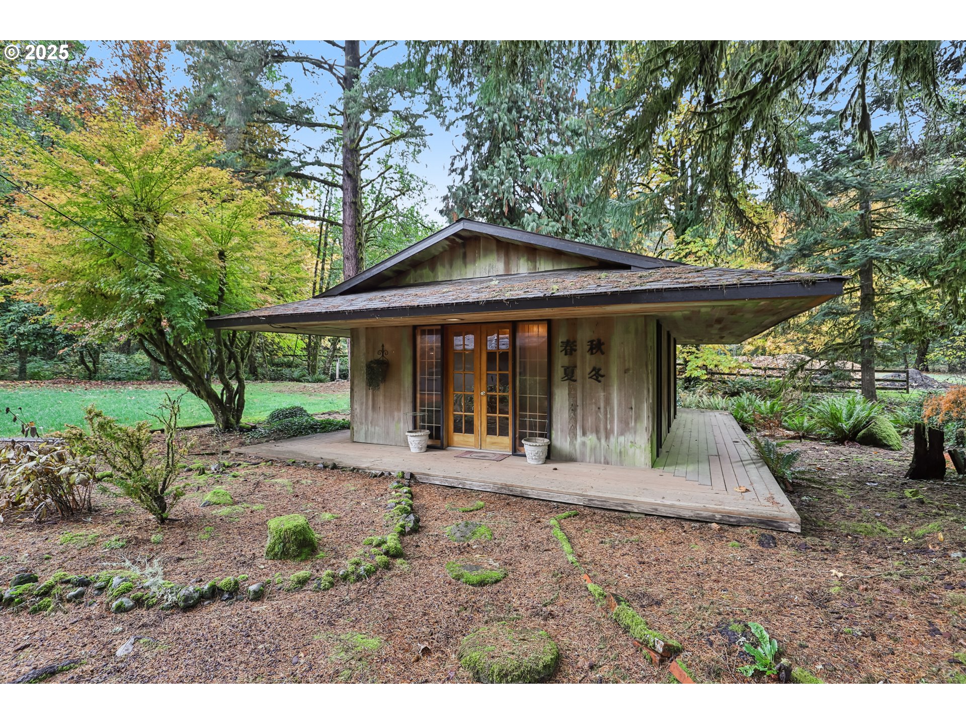 39777 Northwest Murtaugh Road North Plains, OR 97133 - Photo 30 of 45 a front view of a house with a garden