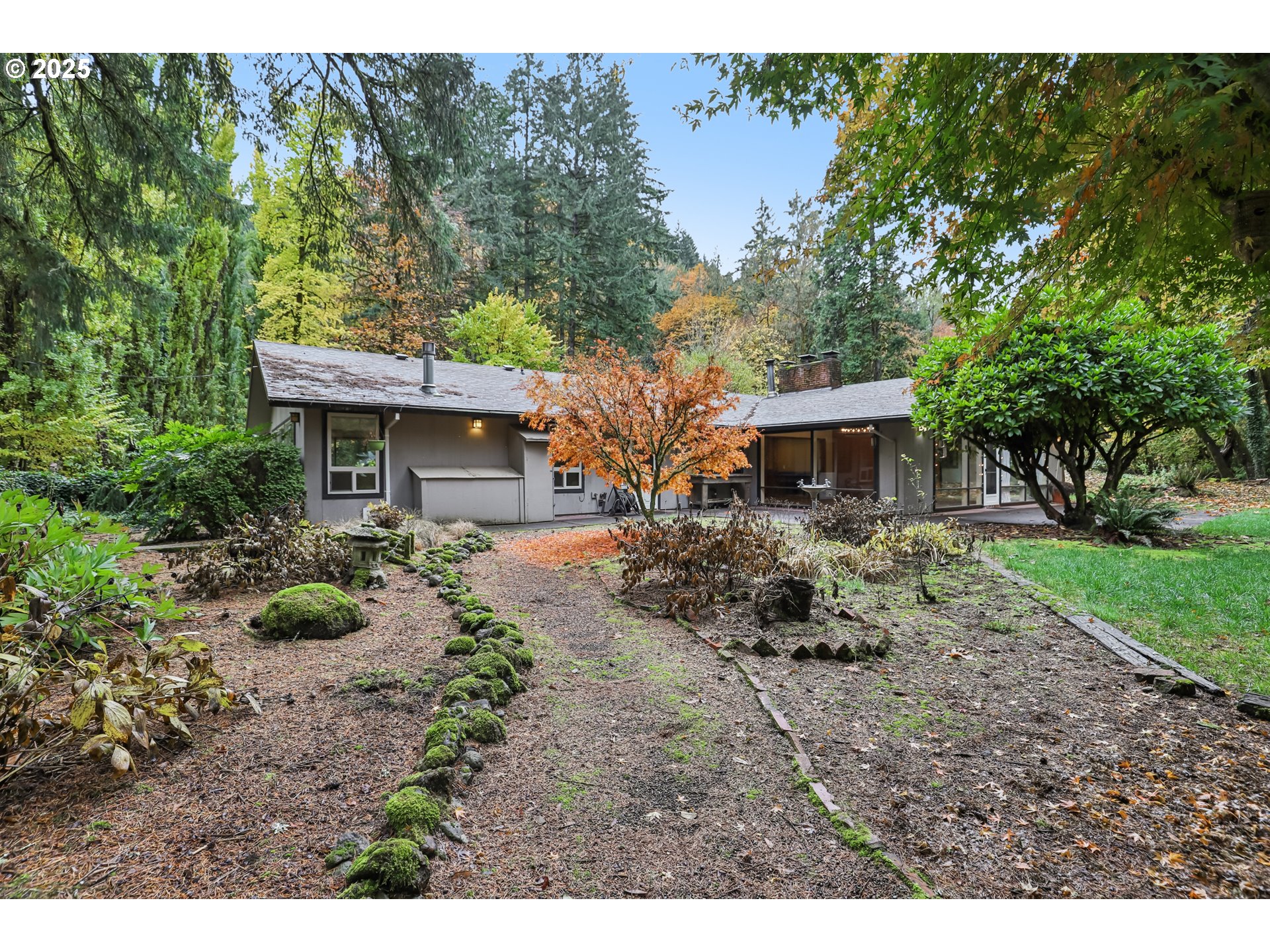 39777 Northwest Murtaugh Road North Plains, OR 97133 - Photo 35 of 45 a backyard of a house with garden and outdoor seating